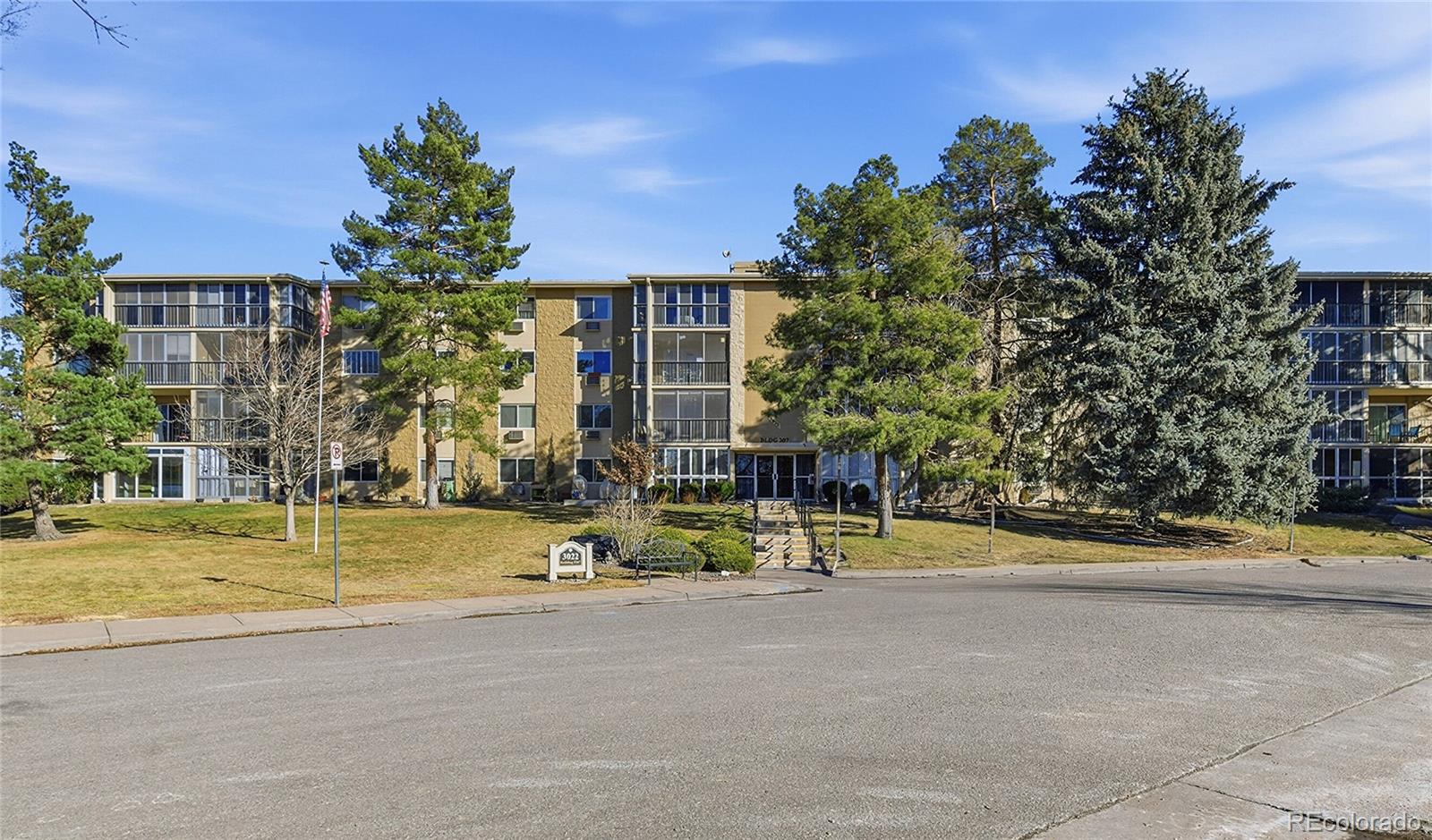 3022 South Wheeling Way, Unit 309 Aurora, CO 80014 - Photo 1 of 26 a view of a house with a yard and a fountain