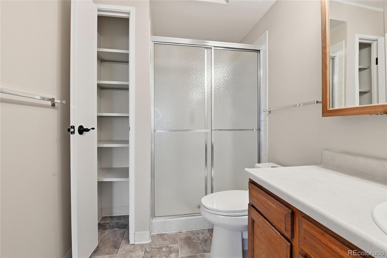 3022 South Wheeling Way, Unit 309 Aurora, CO 80014 - Photo 18 of 26 a bathroom with a sink a toilet and shower