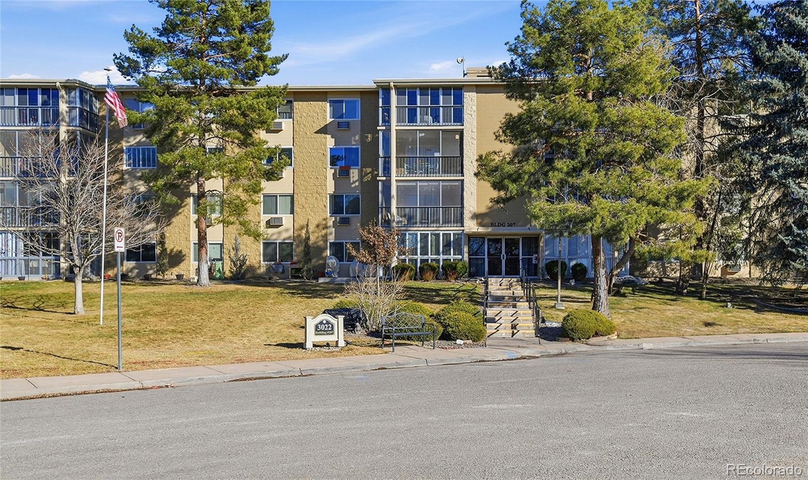 3022 South Wheeling Way, Unit 309 Aurora, CO 80014 - Photo 2 of 26 front view of a house with a swimming pool