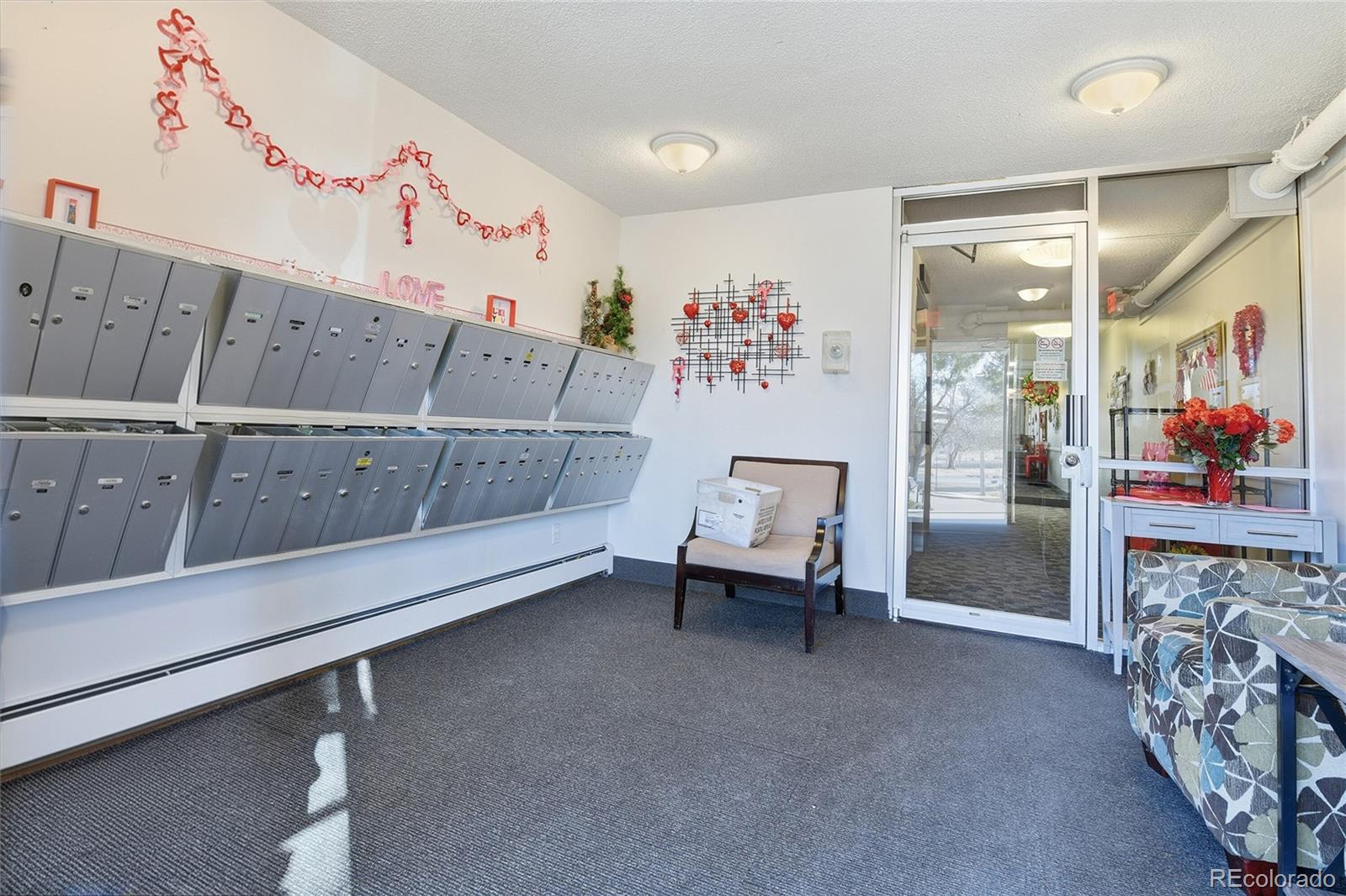 3022 South Wheeling Way, Unit 309 Aurora, CO 80014 - Photo 4 of 26 a view of a room with baby crib and toys