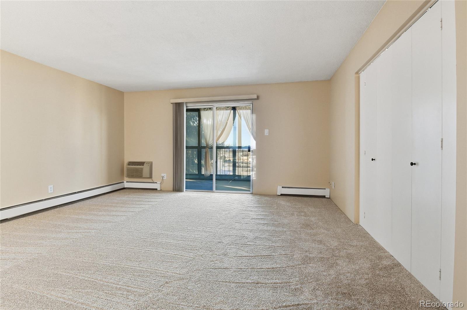 3022 South Wheeling Way, Unit 309 Aurora, CO 80014 - Photo 5 of 26 an empty room with windows