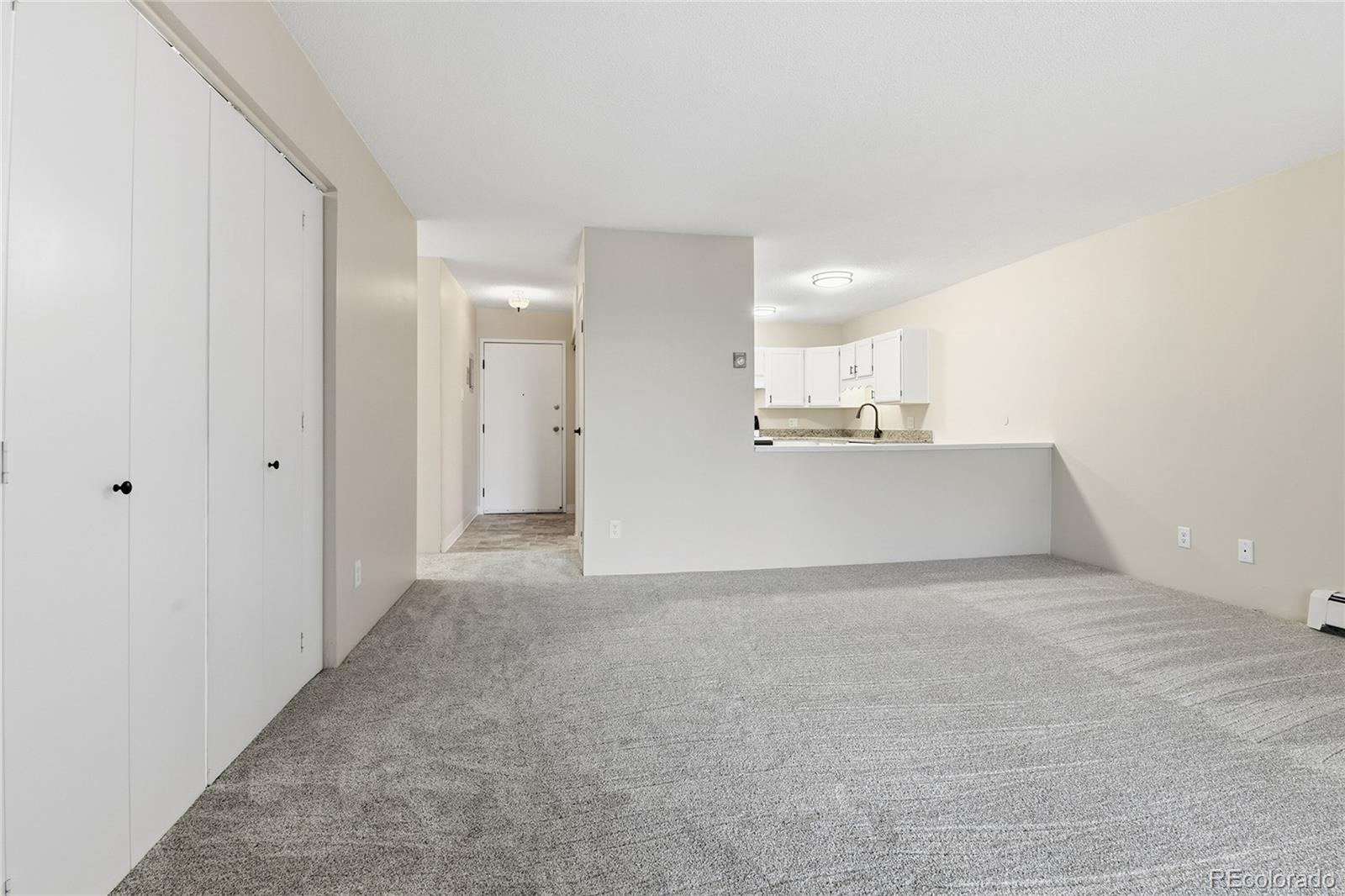 3022 South Wheeling Way, Unit 309 Aurora, CO 80014 - Photo 7 of 26 a view of a kitchen with a sink and a cabinet