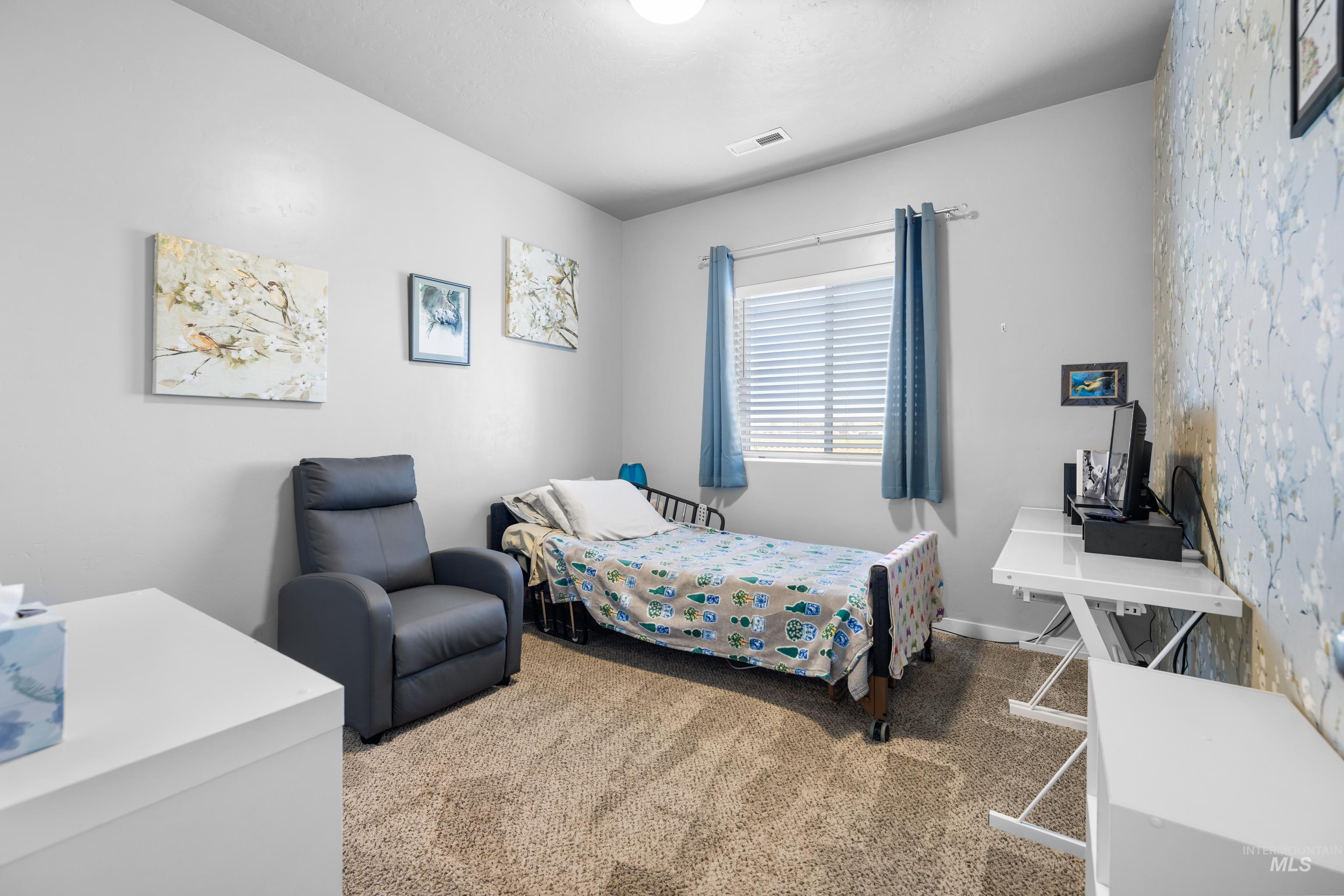 6988 West Spur Street Boise, ID 83709 - Photo 17 of 37 Bedroom with light colored carpet