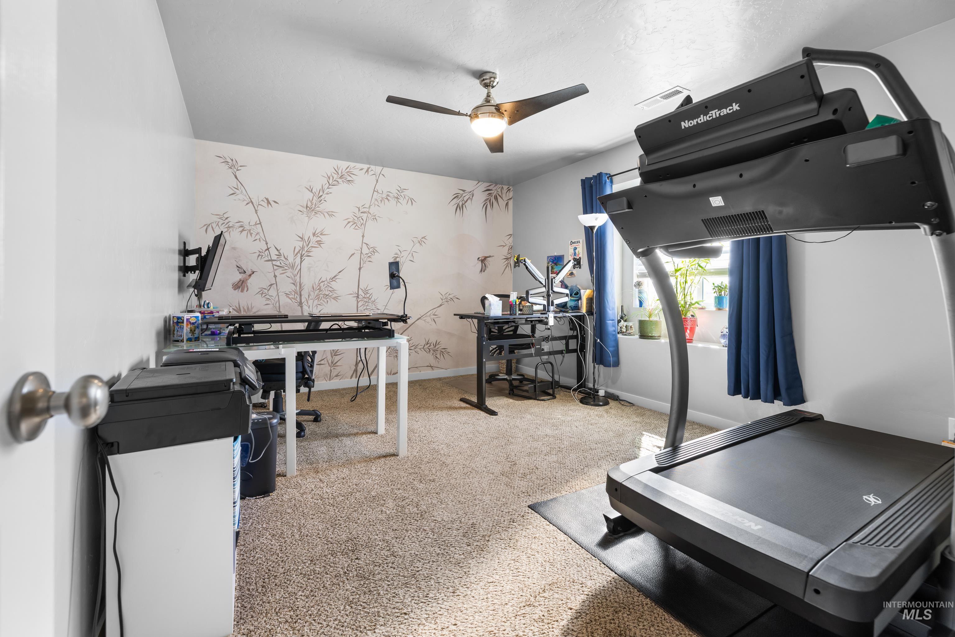 6988 West Spur Street Boise, ID 83709 - Photo 19 of 37 Exercise area featuring a ceiling fan, light colored carpet, and wallpapered walls