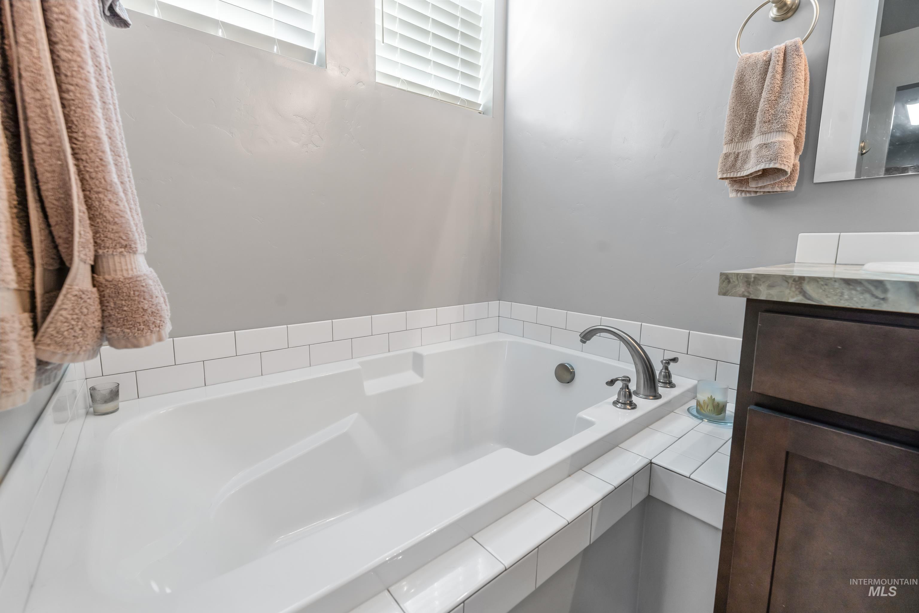 6988 West Spur Street Boise, ID 83709 - Photo 30 of 37 Full bathroom with vanity and a bath