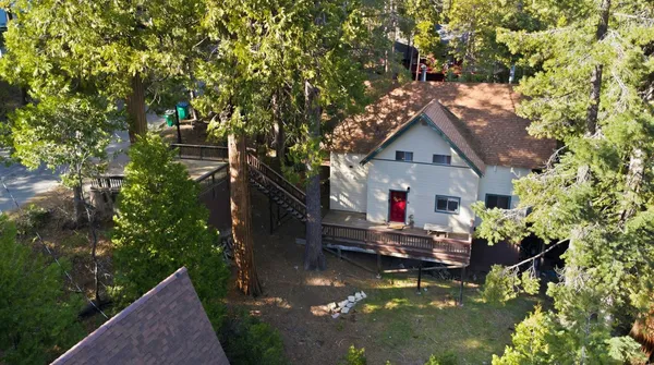 a view of house with swimming pool