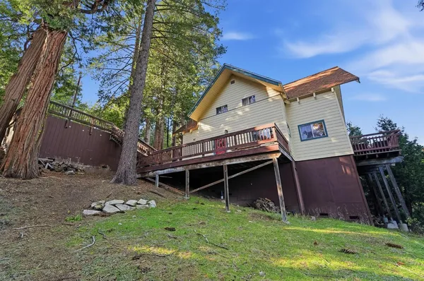 a kitchen with white cabinets and sink