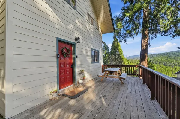 a large white kitchen with stainless steel appliances and white cabinets