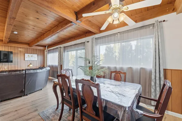 a balcony with wooden floor and outdoor space