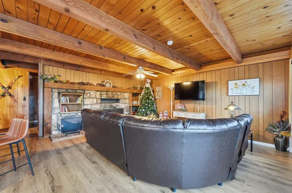 a bedroom with a large bed and a chandelier