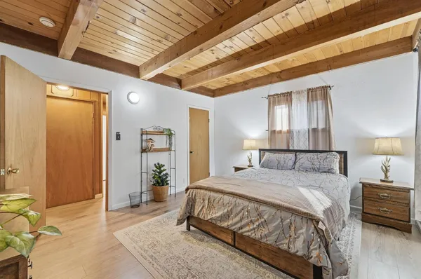 a room with pool table and windows