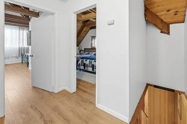 a view of an entryway with wooden floor and stairs