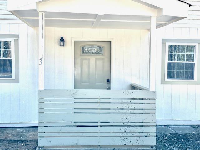 a view of front door and bedroom