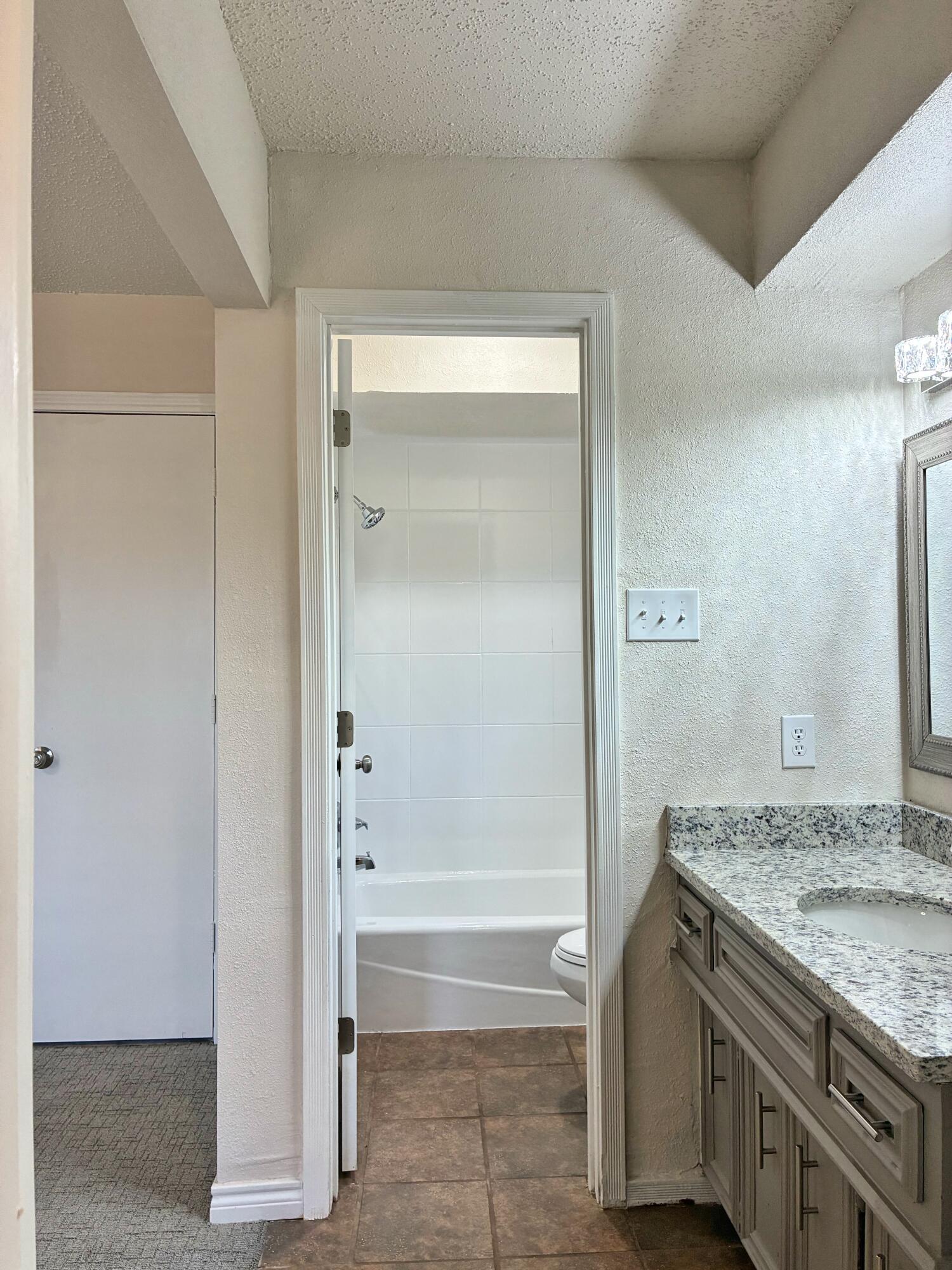 4904 64th Street Lubbock, TX 79414 - Photo 21 of 49 Looking into Primary Bath