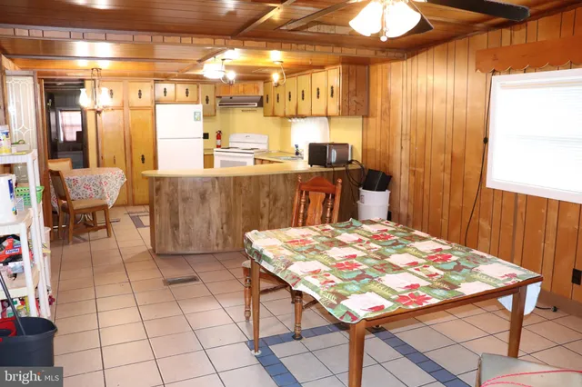 a open kitchen with a table and chairs