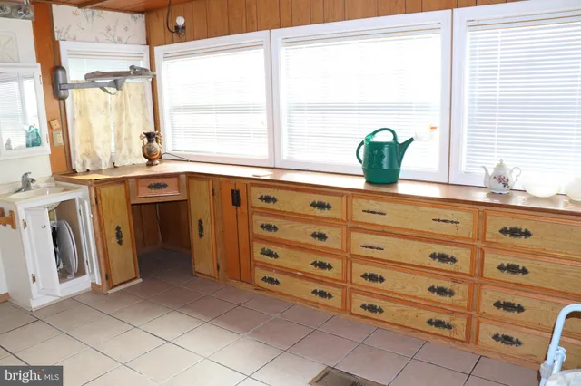 a kitchen with a cabinets and a window