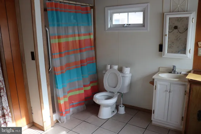 a bathroom with a toilet and a sink