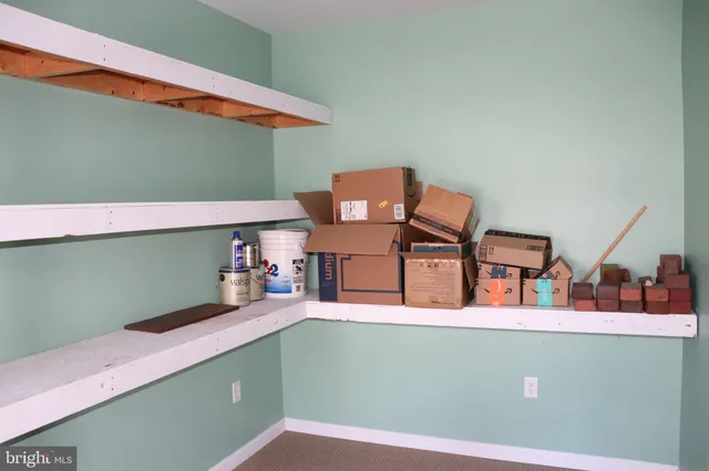 a bathroom with a sink vanity and a mirror