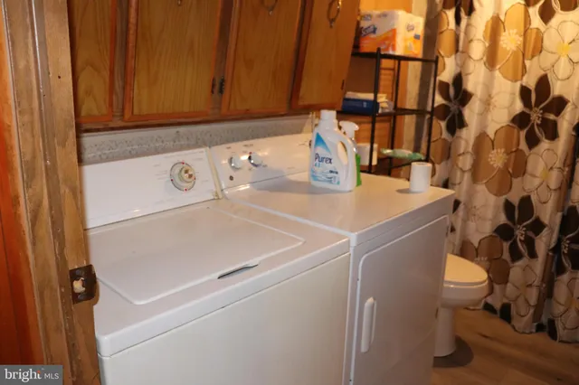 a bathroom with a toilet and shower