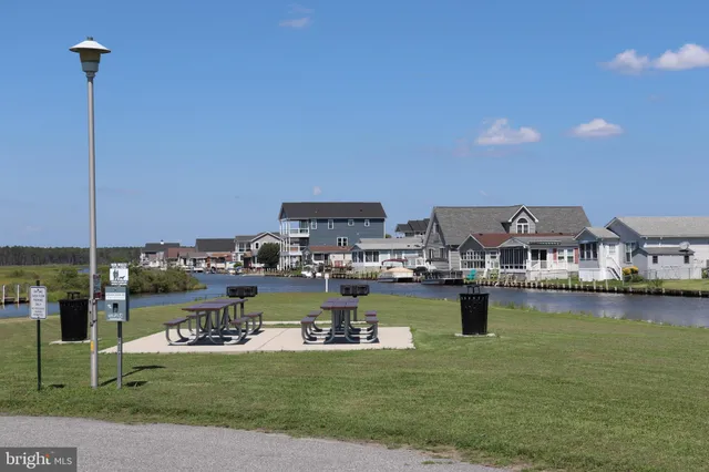 a view of a patio with table and chairs potted plants with wooden floor