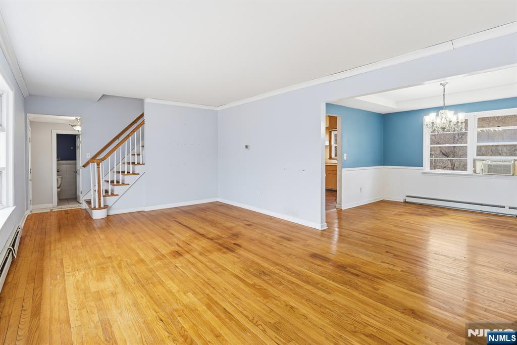 229 Edwards Road Parsippany, NJ 07054 - Photo 13 of 34 a view of an empty room with wooden floor and a window