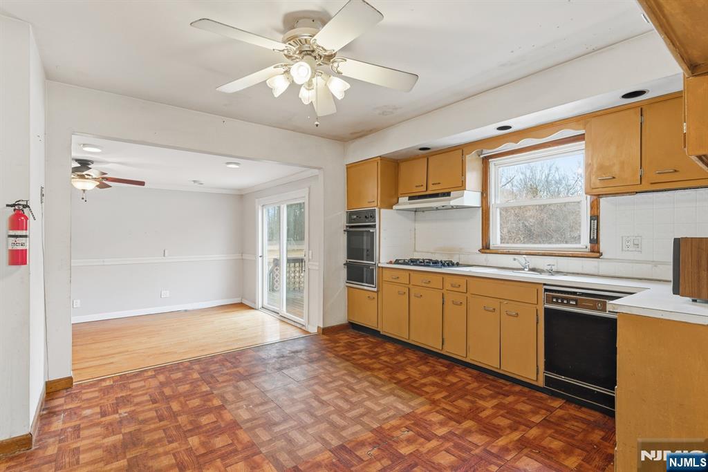 229 Edwards Road Parsippany, NJ 07054 - Photo 16 of 34 a kitchen with stainless steel appliances granite countertop a sink cabinets and window