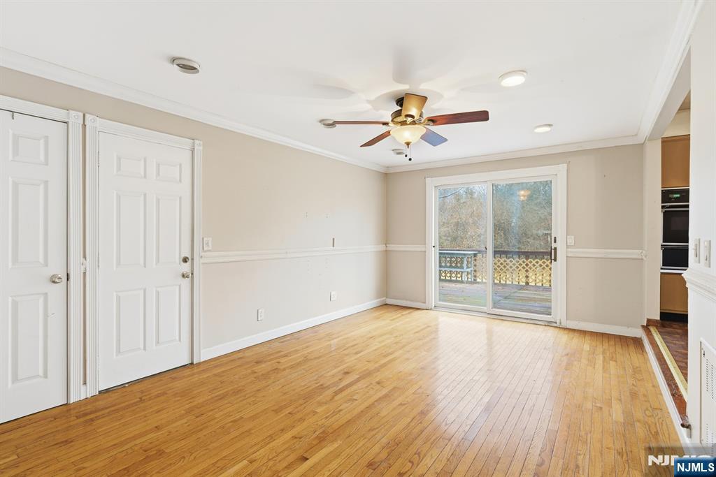 229 Edwards Road Parsippany, NJ 07054 - Photo 20 of 34 a view of an empty room with a window and wooden floor