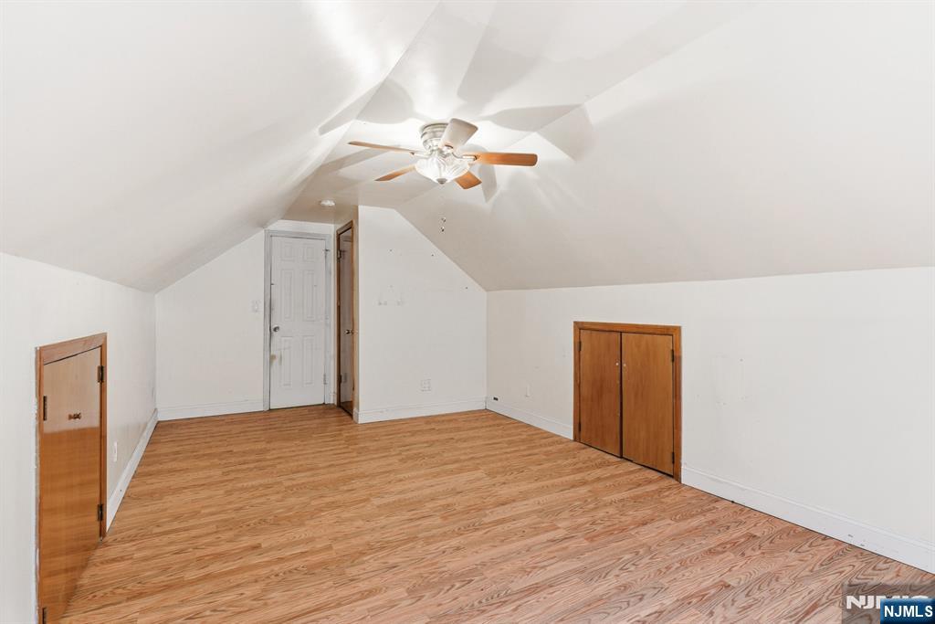 229 Edwards Road Parsippany, NJ 07054 - Photo 23 of 34 a bedroom with a bed and a chandelier