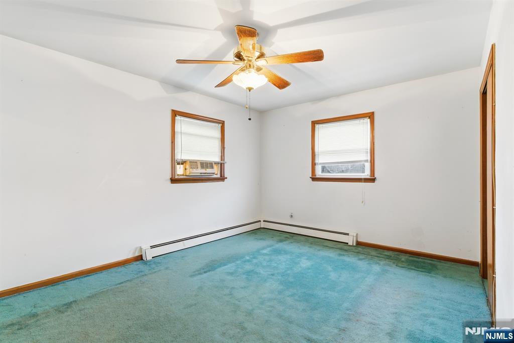 229 Edwards Road Parsippany, NJ 07054 - Photo 25 of 34 an empty room with fan and windows