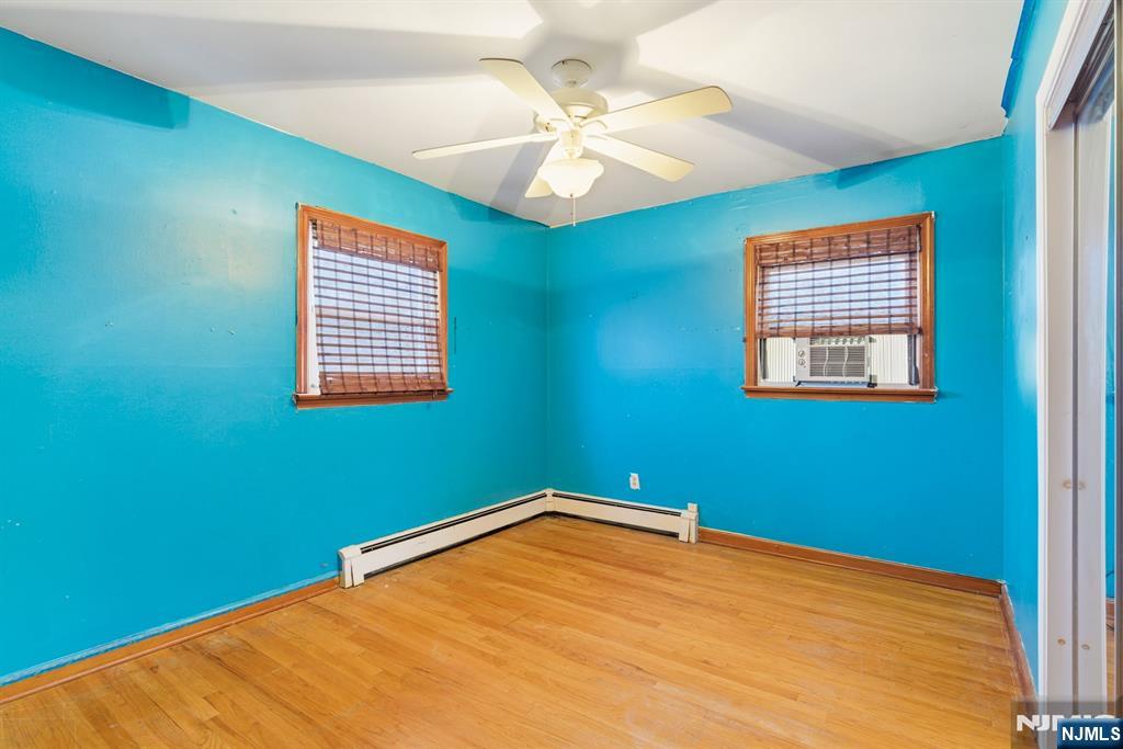 229 Edwards Road Parsippany, NJ 07054 - Photo 29 of 34 a view of a room with a ceiling fan and a window