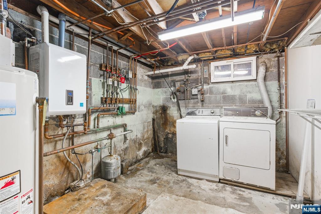 229 Edwards Road Parsippany, NJ 07054 - Photo 34 of 34 a utility room with dryer and washer