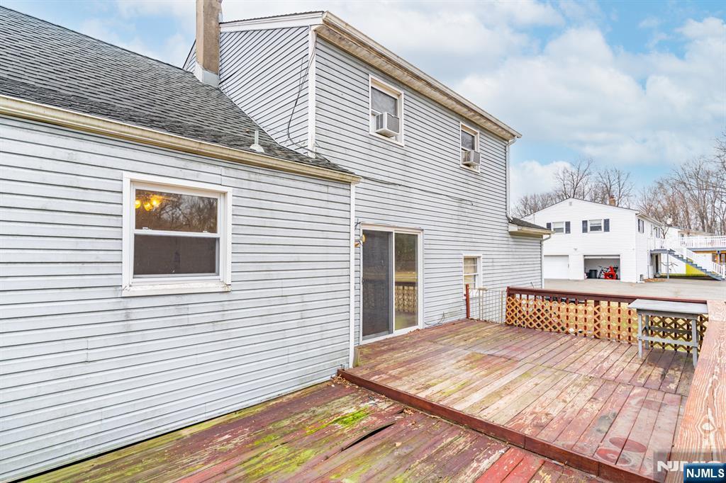 229 Edwards Road Parsippany, NJ 07054 - Photo 8 of 34 a view of a house with a roof deck