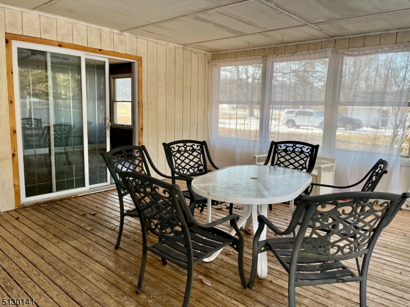 67 Rt 645 Layton, NJ 07851 - Photo 14 of 16 a view of a dining room with furniture window and outside view