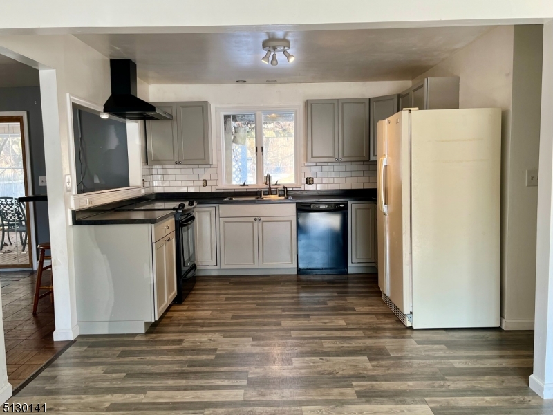 67 Rt 645 Layton, NJ 07851 - Photo 3 of 16 a kitchen with stainless steel appliances granite countertop a stove a refrigerator and a sink
