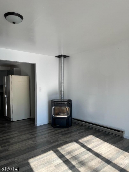67 Rt 645 Layton, NJ 07851 - Photo 7 of 16 a view of a hallway with wooden floor and a cabinet