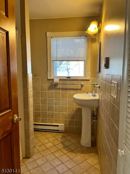 67 Rt 645 Layton, NJ 07851 - Photo 9 of 16 a bathroom with a sink mirror and toilet