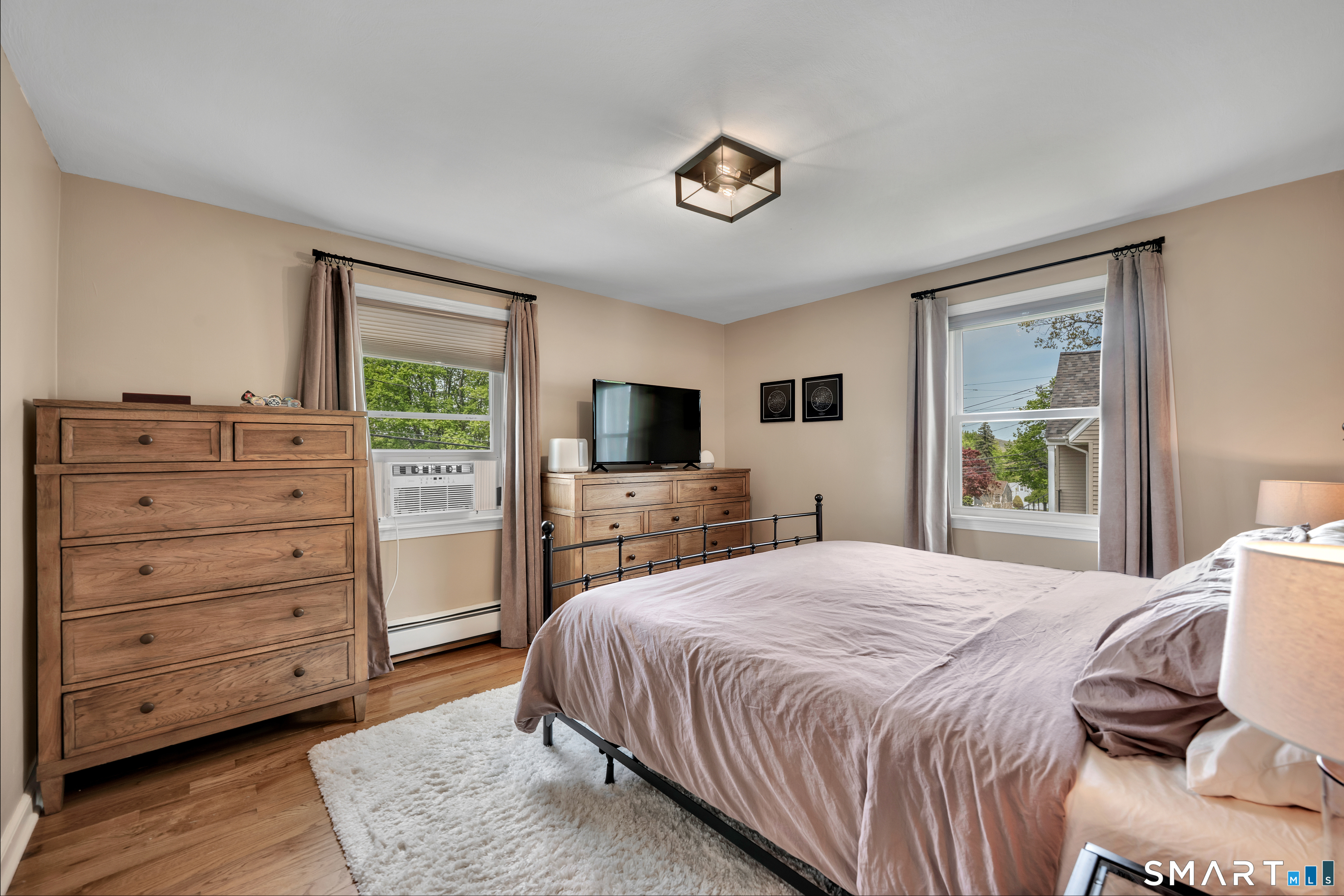 14 Baldwin Street Meriden, CT 06451 - Photo 15 of 35 a bedroom with a bed and a flat screen tv