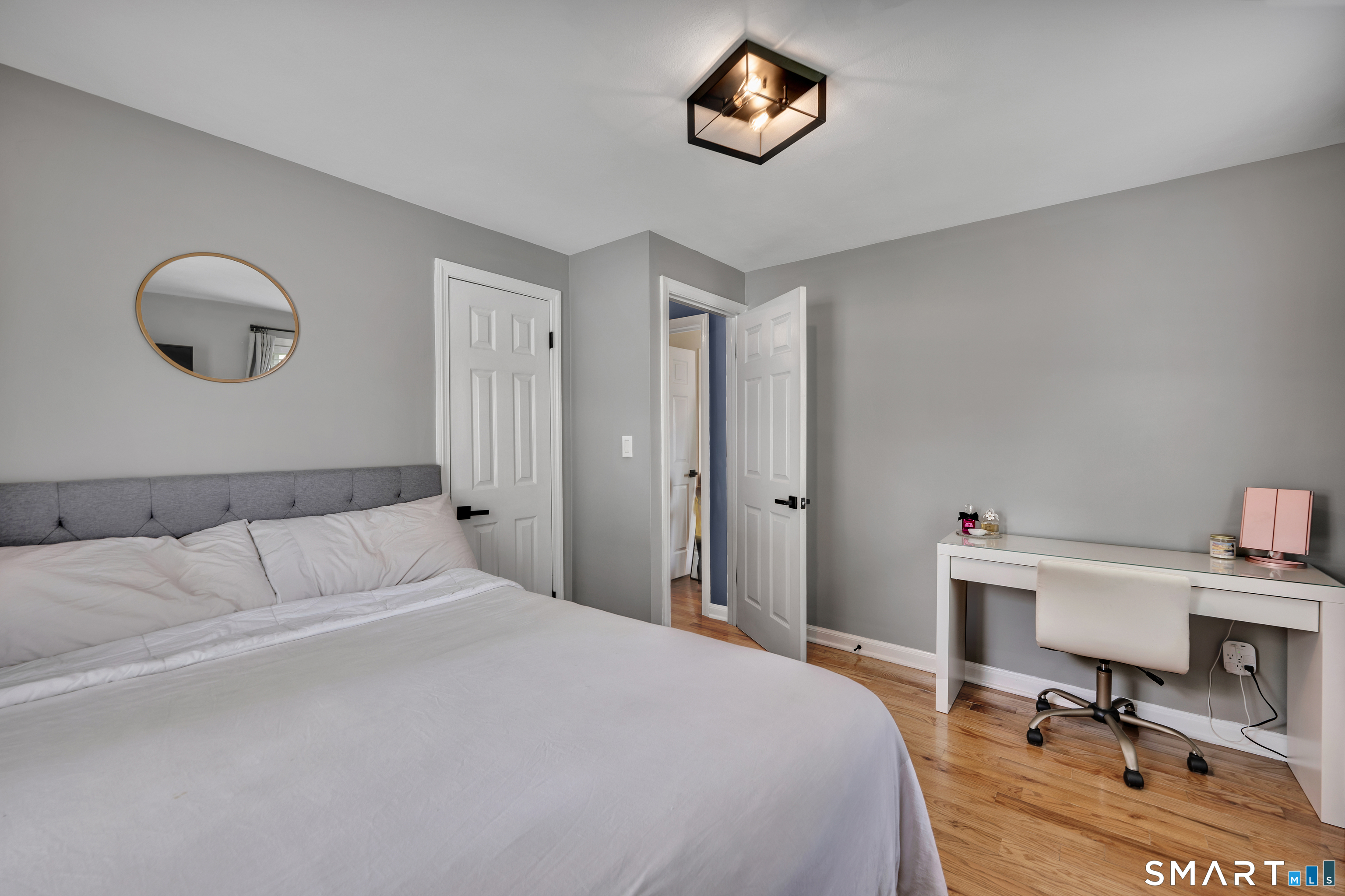 14 Baldwin Street Meriden, CT 06451 - Photo 16 of 35 a bedroom with a bed and a desk