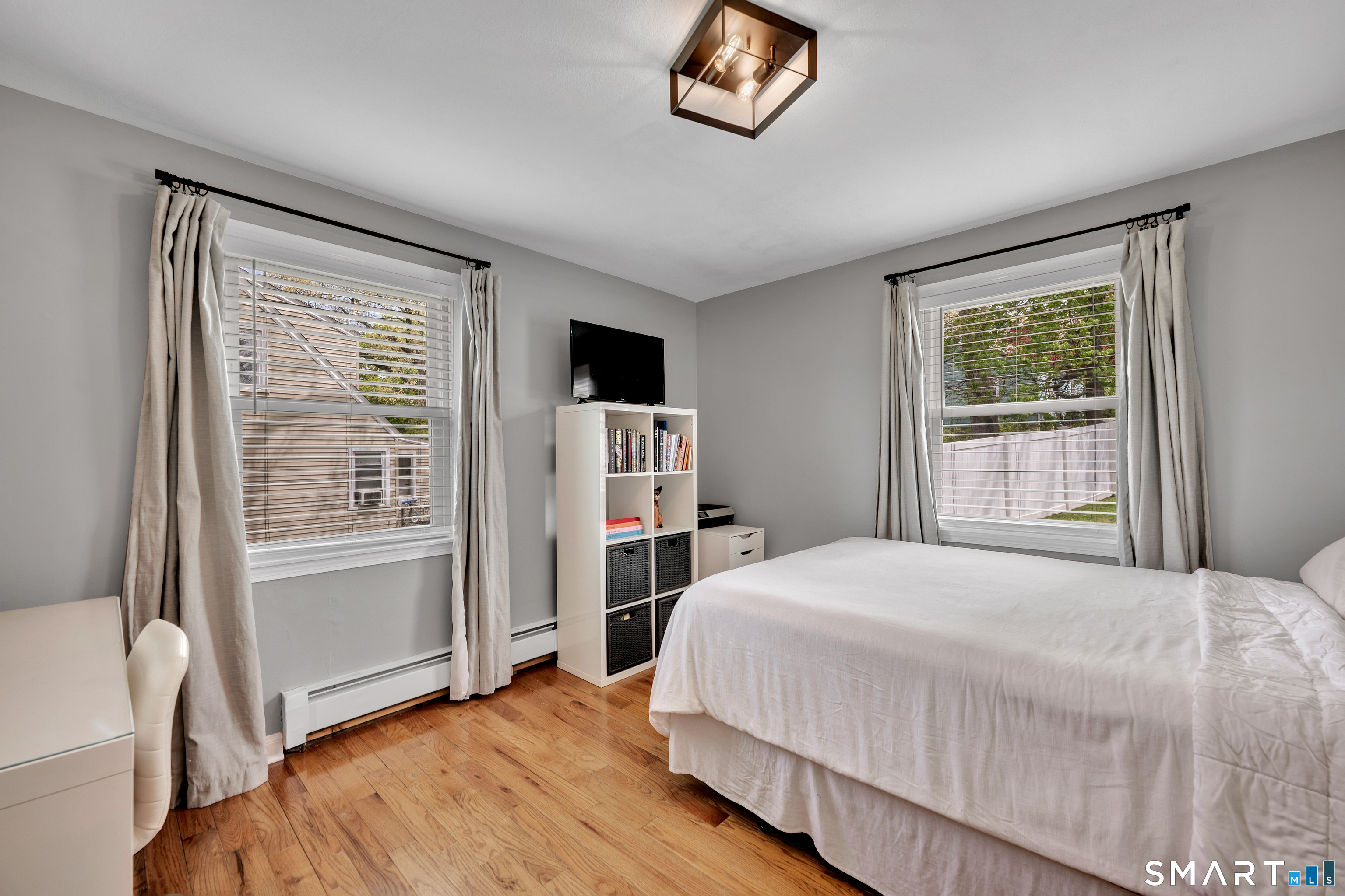 14 Baldwin Street Meriden, CT 06451 - Photo 17 of 35 a bedroom with a bed and a window