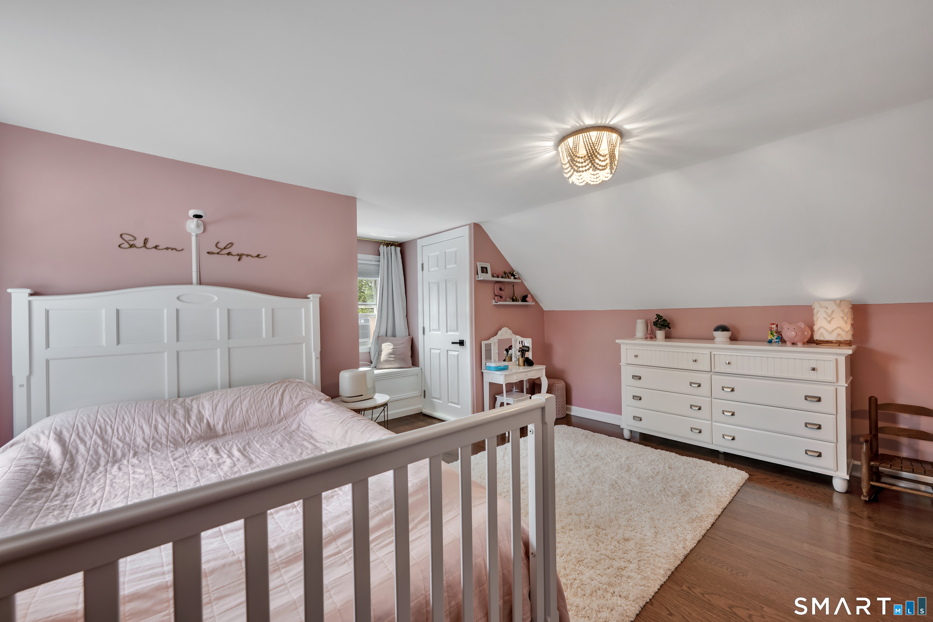 14 Baldwin Street Meriden, CT 06451 - Photo 22 of 35 a bedroom with a bed and a window