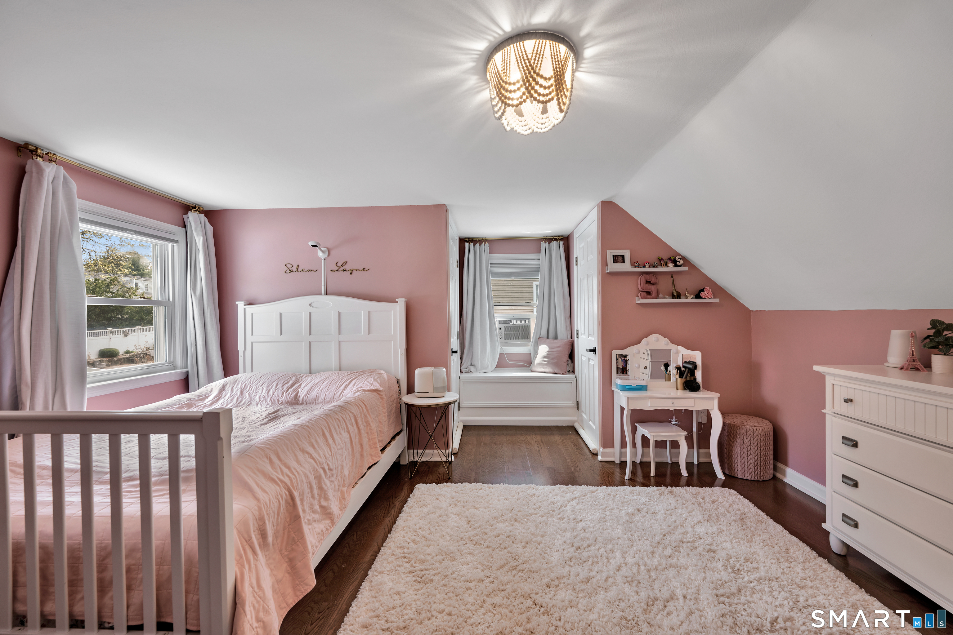 14 Baldwin Street Meriden, CT 06451 - Photo 23 of 35 a bedroom with a bed and a chandelier