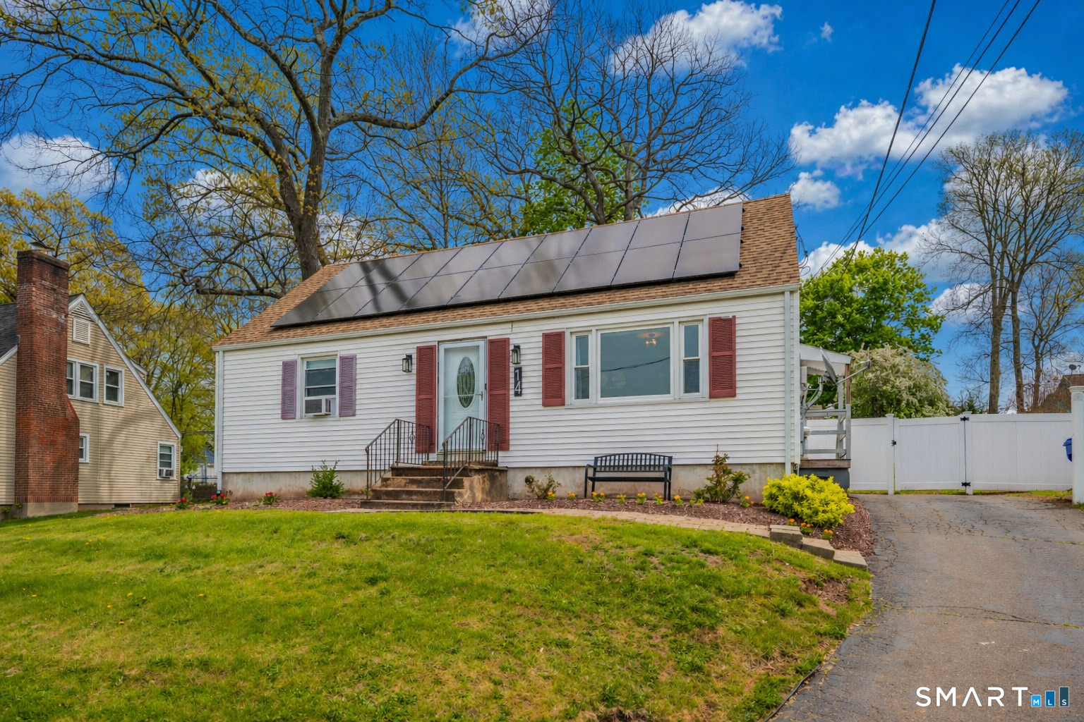 14 Baldwin Street Meriden, CT 06451 - Photo 3 of 35 a front view of house with yard and trees around