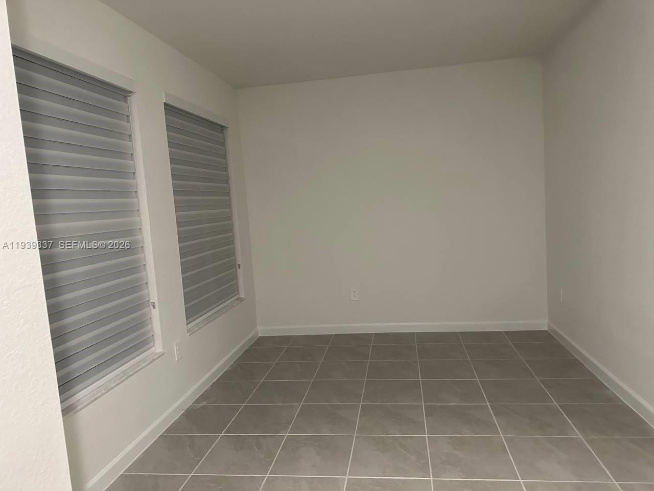 14816 Southwest 265th Street Homestead, FL 33032 - Photo 16 of 16 a view of an empty room
