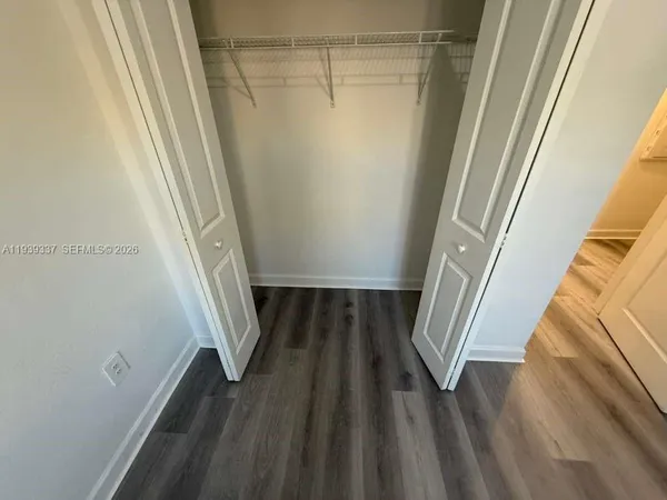 a view of an empty room and window