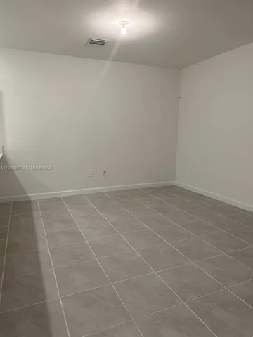 a view of a room with an empty space