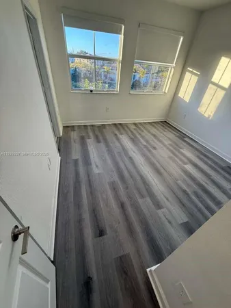 a kitchen with stainless steel appliances a refrigerator sink and microwave