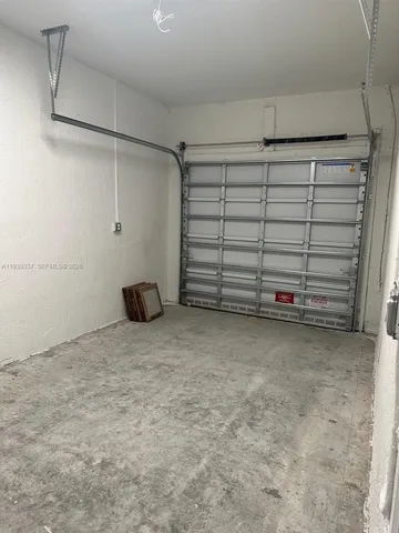 an empty room with a bathroom