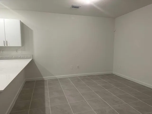 an empty room with a bathroom