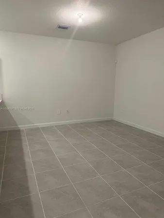 a view of a room with an empty space