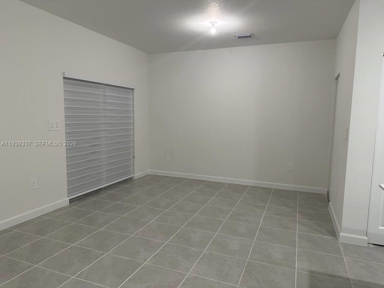 14816 Southwest 265th Street Homestead, FL 33032 - Photo 8 of 16 an empty room with a bathroom